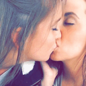 Lesbian girlfriends kissing and grinding