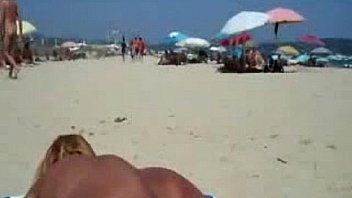 Mature slut masturbate dick on beach